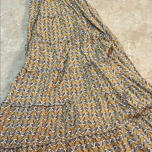 Bohemian style skirt loose fitting and has tiers yellow and white